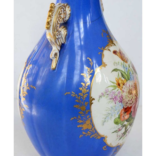 75A - A pair of Staffordshire dragon handled bone china bottle shaped vases and covers, c1850, painted to ... 