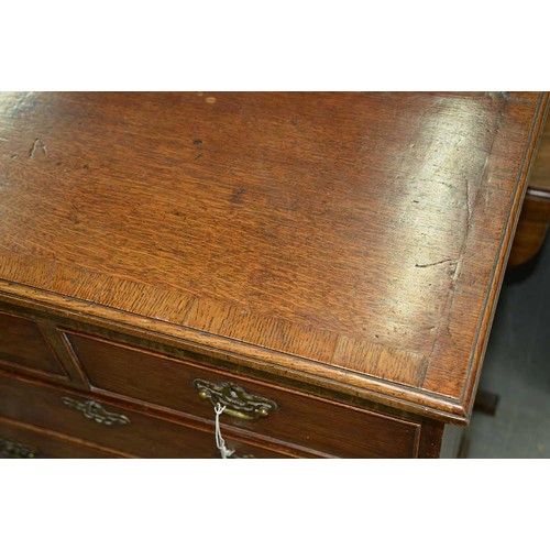 604 - An oak chest of drawers, 19th c, the crossbanded, moulded top above two short and four graduated dra... 