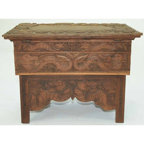 645 - A Chinese carved wood collapsible table, early 20th c, the top and all sides decorated with phoenix ... 