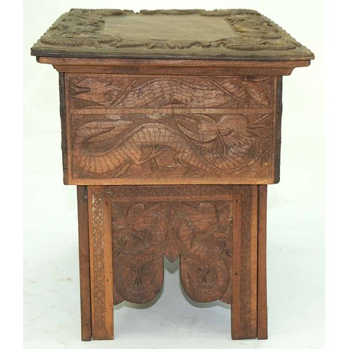 645 - A Chinese carved wood collapsible table, early 20th c, the top and all sides decorated with phoenix ... 