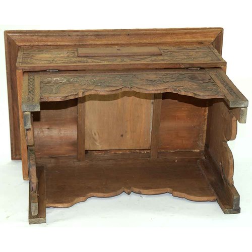 645 - A Chinese carved wood collapsible table, early 20th c, the top and all sides decorated with phoenix ... 