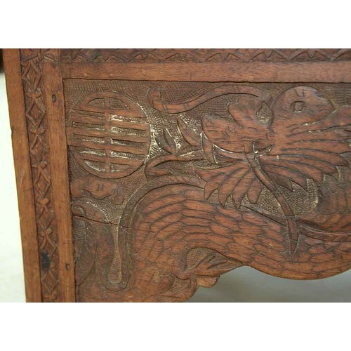 645 - A Chinese carved wood collapsible table, early 20th c, the top and all sides decorated with phoenix ... 