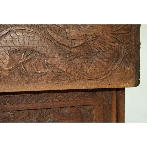 645 - A Chinese carved wood collapsible table, early 20th c, the top and all sides decorated with phoenix ... 