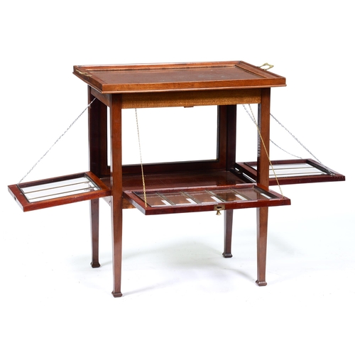 1089 - A mahogany brass handled tray top table, early 20th c, the glazed sides of the table incorporating t... 