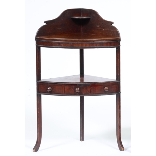 1109 - A George III mahogany bow fronted corner washstand, 104cm h; 39 x 61cm