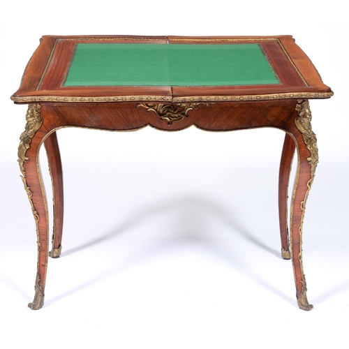 1121 - A French kingwood card table, 19th c, in Louis XV style, with ormolu mounts, the serpentine quarter ... 