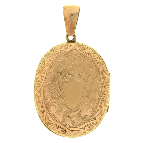 17 - An engraved gold mounted locket, 33mm