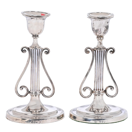 321 - A pair of Victorian silver lyre candlesticks, on oval foot, nozzles, 20.5cm h, by Harrison Brothers ... 