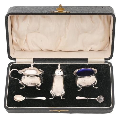 350 - A George V three piece silver condiment set,  blue glass liners, pepoerette  70mm h, by Suckling Ltd... 