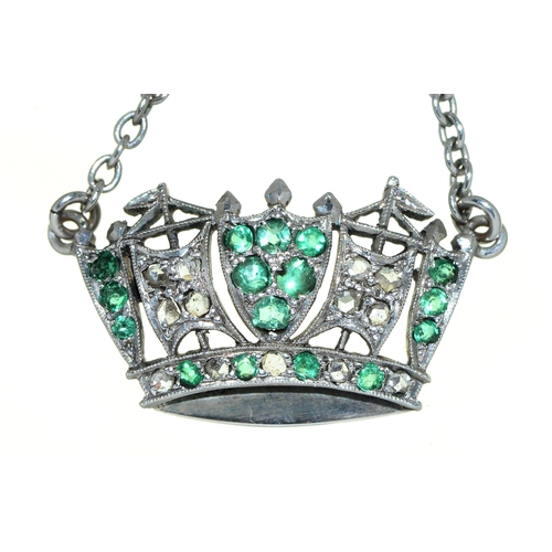 49 - An emerald and diamond naval crown pendant, c1930, in white gold, 25mm l, marked 9ct PLAT, on integr... 