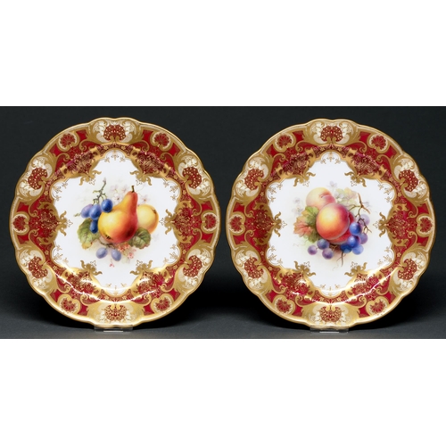 578 - A pair of Royal Worcester dessert plates, 1911, painted by F Roberts, both signed, with fruit in cla... 