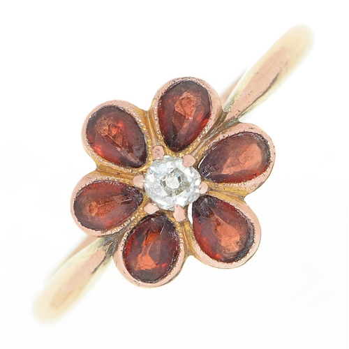58 - A diamond and garnet flower cluster ring, in gold marked 9ct, 2.8g, size Q