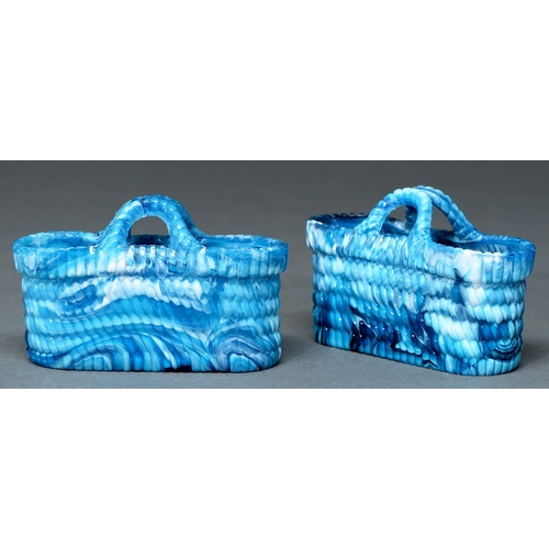 585 - A pair of Sowerby press moulded 'blue malachite' glass baskets, c1880, 11cm l, moulded peacock crest... 