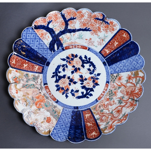 609 - A Japanese Imari dish or plaque, Meiji period, of kiku form, 64.5cm diam