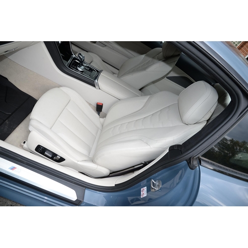 617 - Motor Car. Exceptionally low mileage 2019 (May) BMW 840D X Drive, two door, blue with cream interior... 