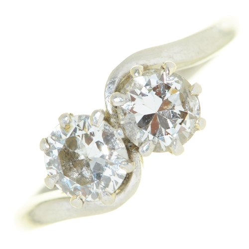 62 - A diamond crossover ring, with round brilliant cut diamonds, in platinum marked PLAT, 3.8g, size M½... 