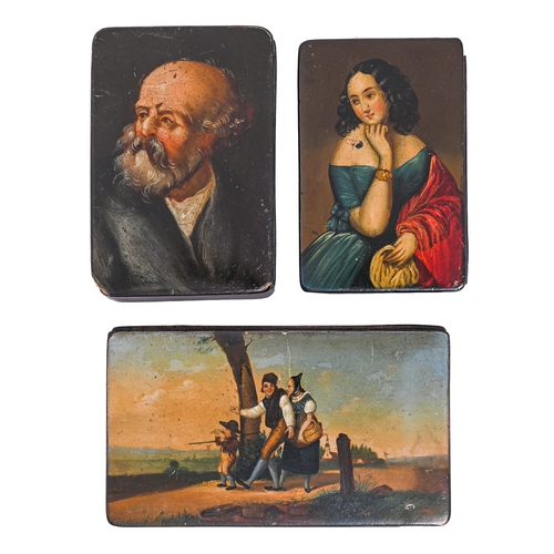 620 - Three  papier-mache snuff boxes, mid 19th c, the lid painted with a lady in a blue dress, study of a... 