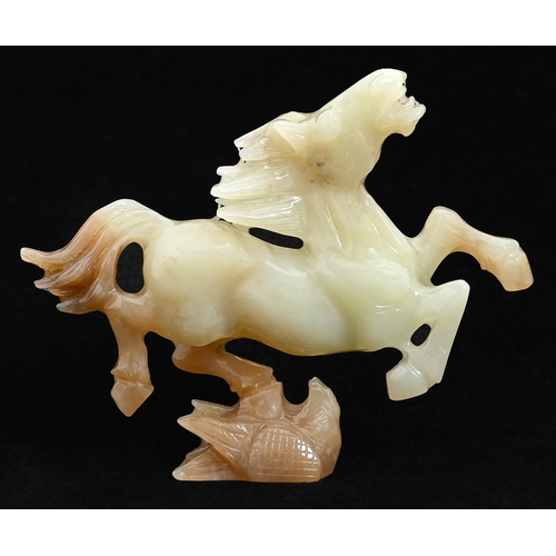 643 - A Chinese jade carving of The Flying Horse of Gansu, 80mm h