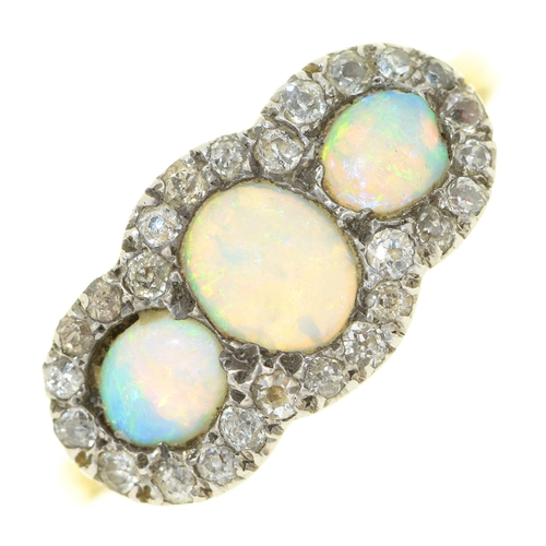 65 - An opal and diamond cluster ring, in gold, apparently unmarked, 3.9g, size P