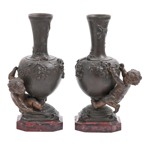 709 - A pair of French fin de siecle bronzed spelter cherub vases, c1900, cast from a model by Auguste Mor... 