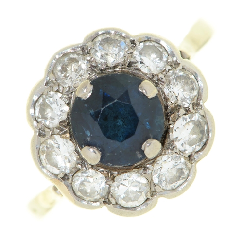 72 - A sapphire and diamond cluster ring, early 20th c, in platinum, unmarked, 3g, size I½... 