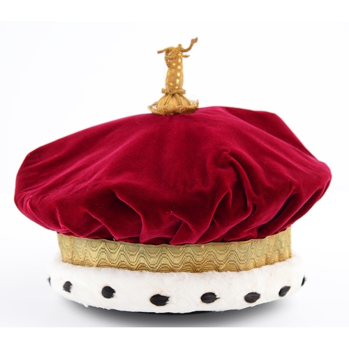 774A - Ceremonial robes. Mantle and Chapeau by Ede & Ravenscroft Ltd, c1980, of red plush and gold brai... 