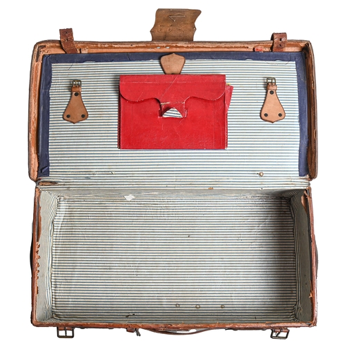 788 - Vintage luggage. A substantial leather suitcase, early 20th c, the brass lock beneath leather flap f... 