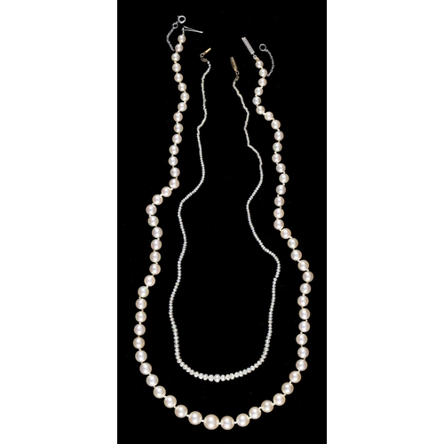 89 - A cultured pearl necklace,  the single row of 4-8mm cultured pearls with engraved white gold box cla... 