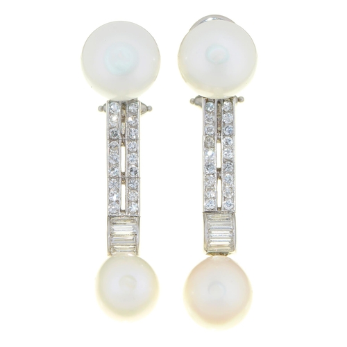 92 - A pair of diamond and cultured pearl earrings, the button and drop shaped cultured pearls divided by... 