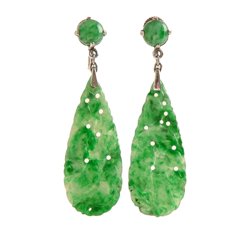 95 - A pair of jadeite earrings, c1930, of tear drop form carved and pierced with fruit and foliage, moun... 