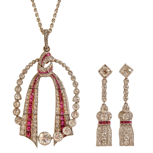 97 - A ruby and diamond pendant and earrings, of tassel design with lines of calibre cut rubies, in white... 