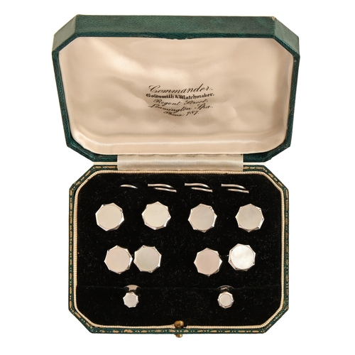 99 - A mother of pearl and white gold dress set, second quarter 20th c, comprising pair of cufflinks and ... 