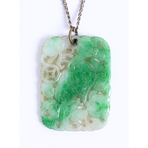 55A - A Chinese jadeite pendant, carved, pierced and engraved with foliage and shou, 35 x 25mm... 