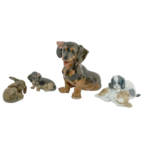 13 - Three Royal Copenhagen porcelain models of dogs and one other, 19cm h and smaller, printed marks... 