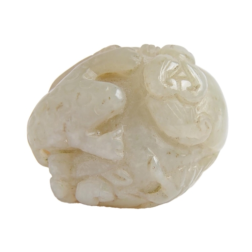 130 - A Chinese jade pebble carving, with a dog of Fo, toad and snake, 44mm l