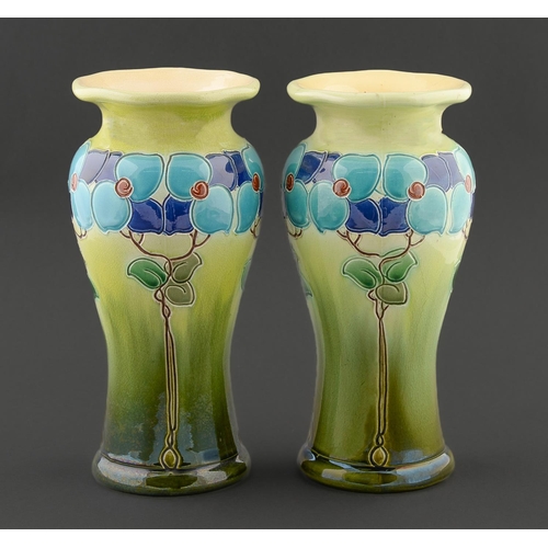 23 - Art pottery. A pair of Burmantofts vases, c1900, impressed with stylised trees with peach shaped lea... 