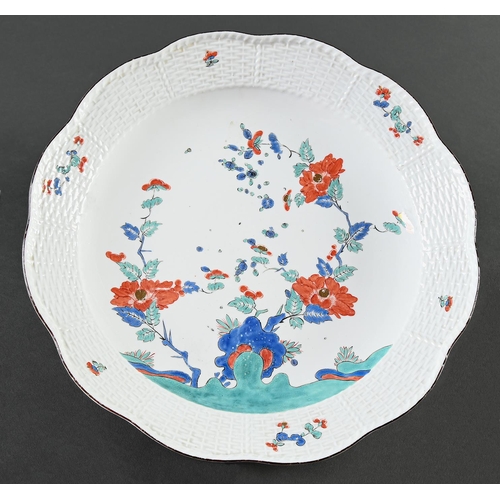 5 - A Meissen Kakiemon dish, c1735, enamelled with flowering plants, the largest sprouting from a blue r... 