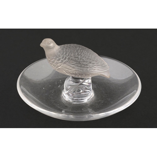 64 - A Lalique clear and frosted glass ashtray in the form of a partridge, 97mm diam