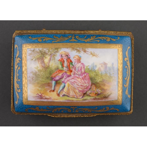 71 - A giltmetal mounted Limoges box, 20th c, painted with lovers beneath a tree reserved on a bleu celes... 