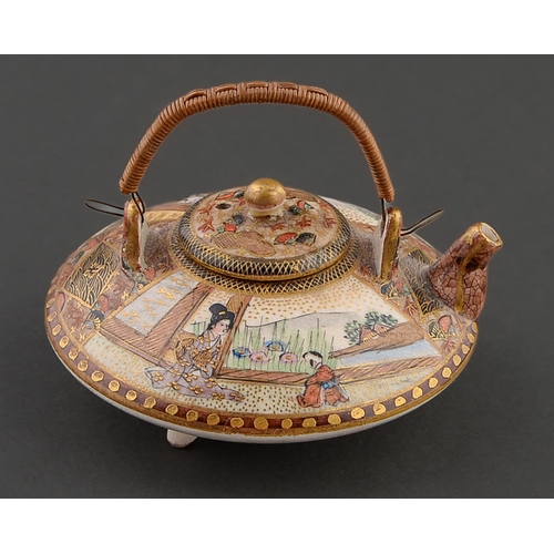 76 - A Japanese miniature Satsuma kettle and cover, Meiji period, enamelled with fan shaped panels of fig... 