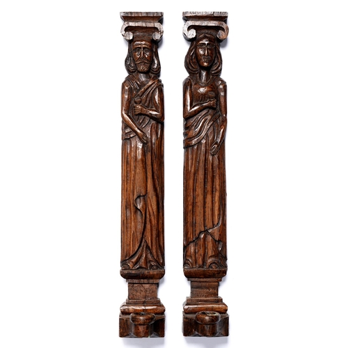 1034 - A pair of 'carved oak' resin medieval figural wall sconces, 20th c, 49cm h