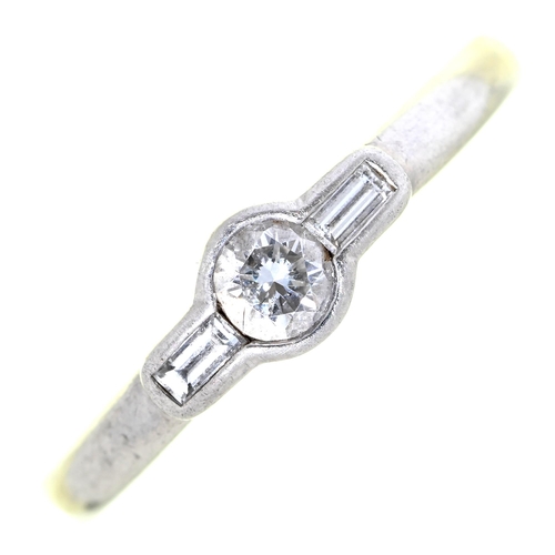 10 - A diamond ring, the round brilliant cut diamond flanked by  baguette diamonds, in platinum, 5.8g, si... 