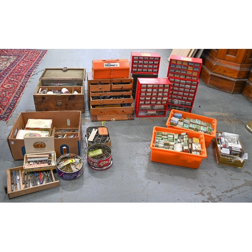 1060 - An extensive stock of screws, bolts and other hardware, sorted into tins, cabinets and boxes... 