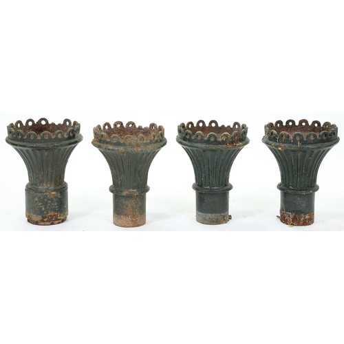 1202 - A set of four Victorian cast iron garden vases, of flared, fluted shape with pierced rim, 44cm h... 