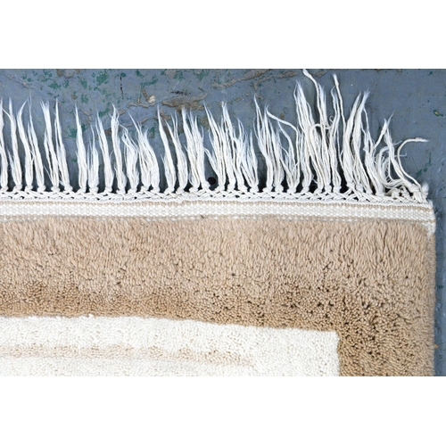 1207 - A beige and cream rug, 455 x 370cm