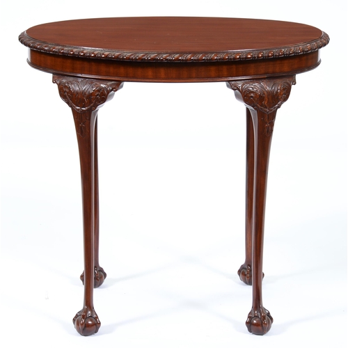 1255 - A mahogany occasional table, early 20th c, the gadrooned oval top on carved cabriole legs and claw a... 