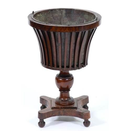 1279 - A Dutch mahogany teestof, 19th c,  the flared, slatted bowl with brass liner, on knopped pillar... 