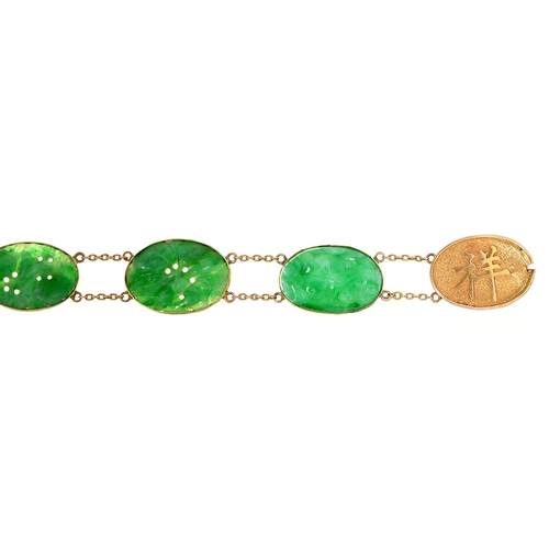 128 - A Chinese carved jadeite bracelet, the six oval links between double chains, the oval gold clasp cha... 