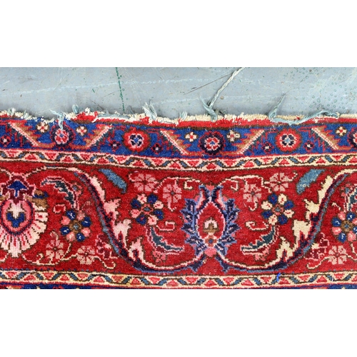 1291 - A red ground rug, 230 x 328cm