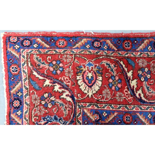 1291 - A red ground rug, 230 x 328cm